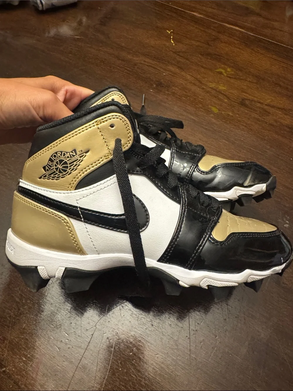 Nike Jordan 1 Kids' mid cleats in Black, White & Gold